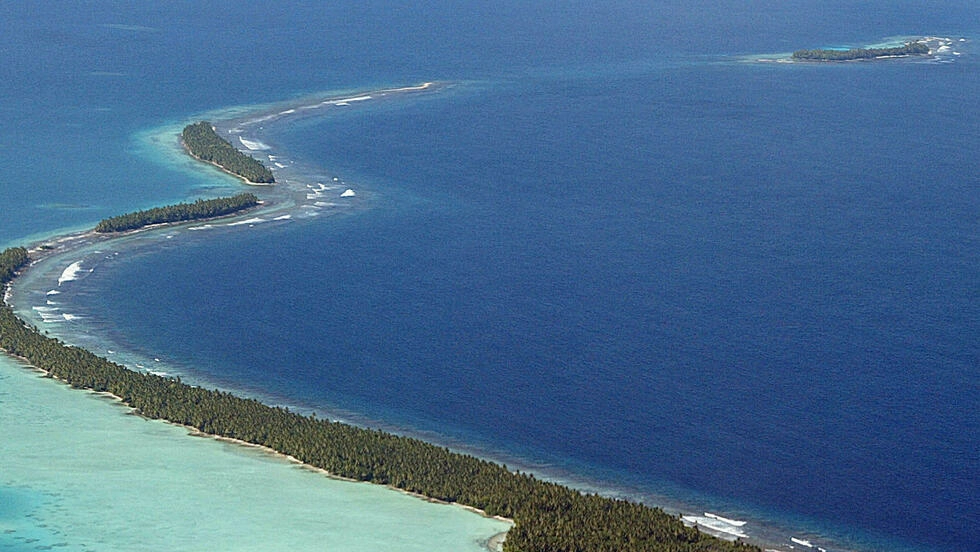 海面上昇などにより、すでにトケラウ、ツバル、キリバスなどの群島の環礁が水没し始めています。AFP PHOTO/Torsten BLACKWOOD